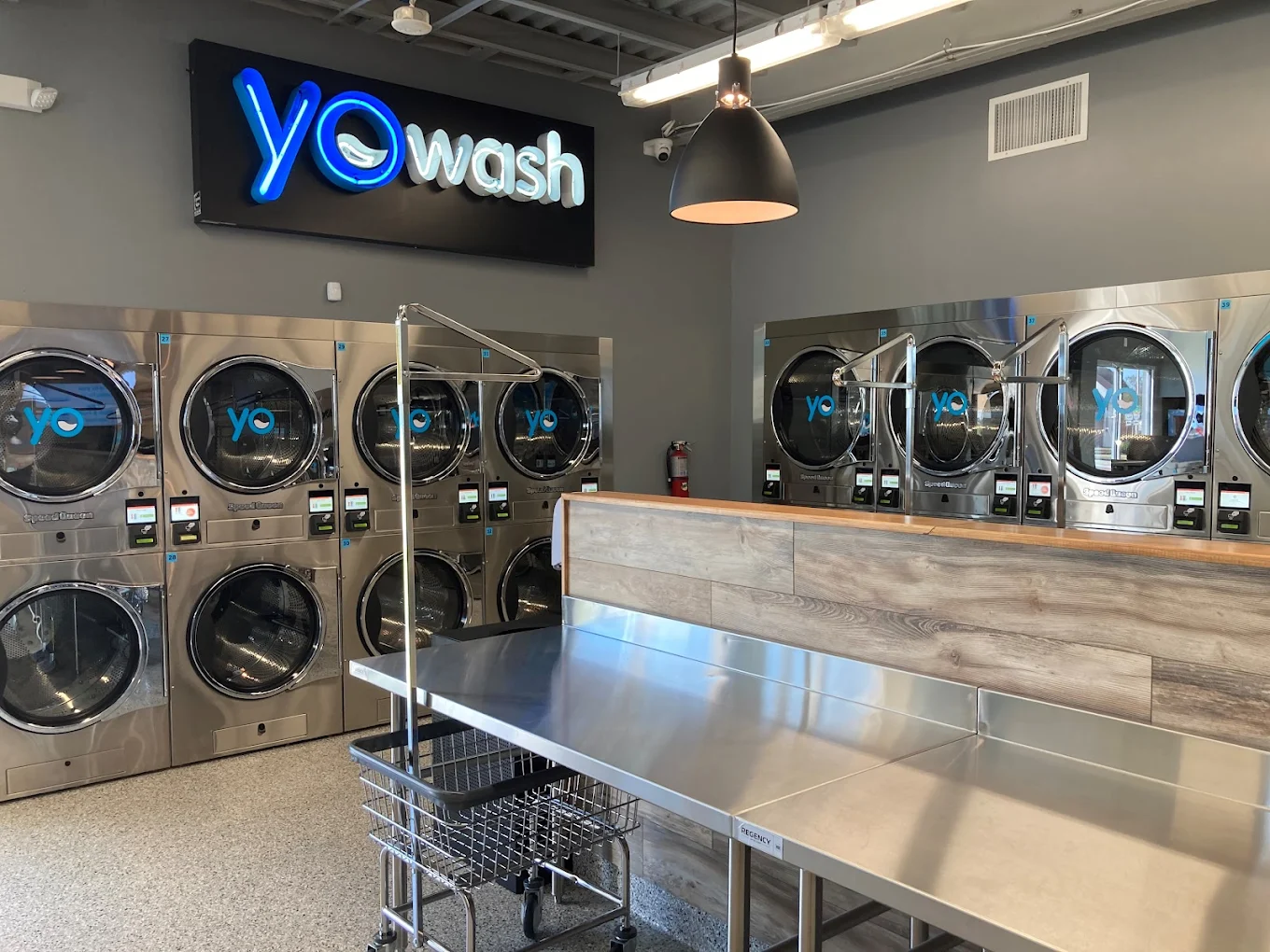 Inside YoWash Lakeland — rows of modern washers and dryers in a bright, clean interior